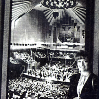 İdil Biret in the Australia Tour. In front of a poster of Sydney Opera House. 1984.